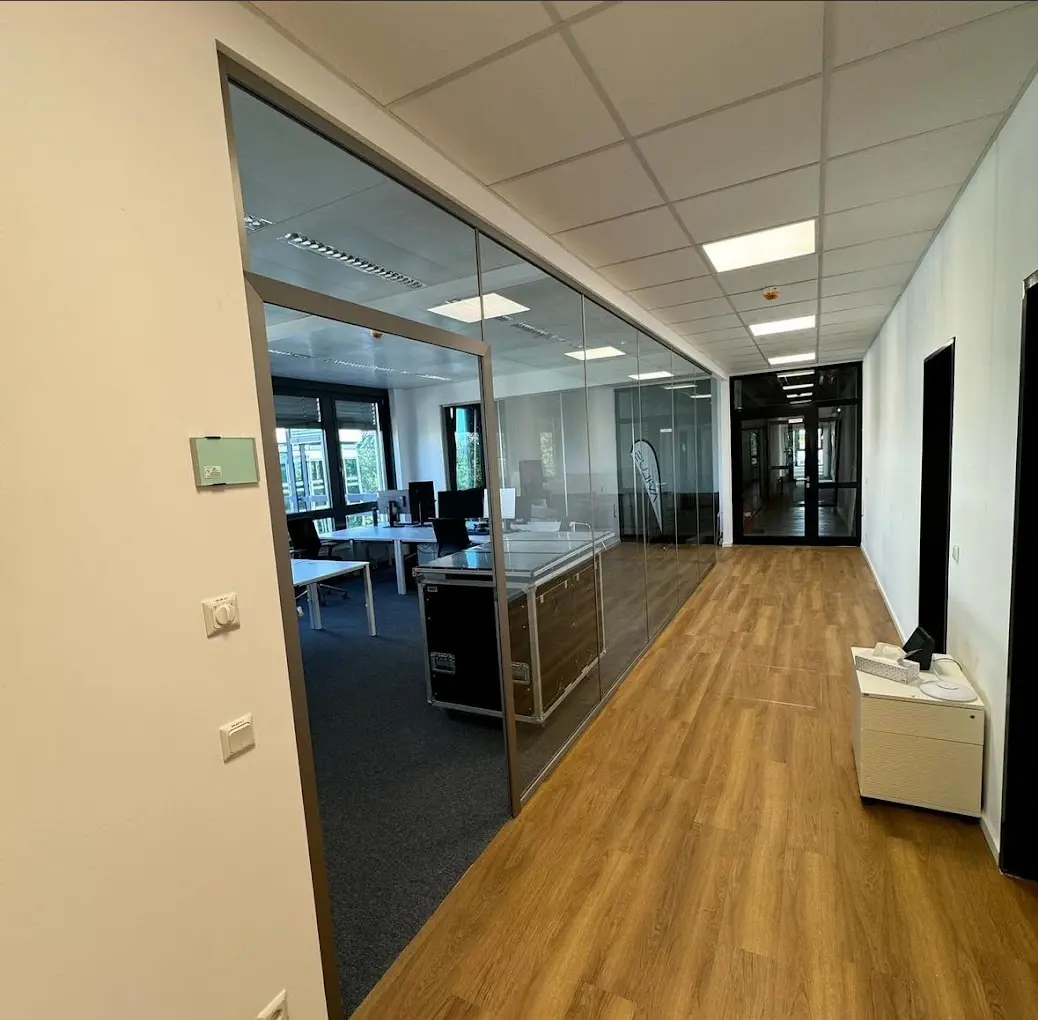 Office wing with a new glazed partition and vinyl flooring