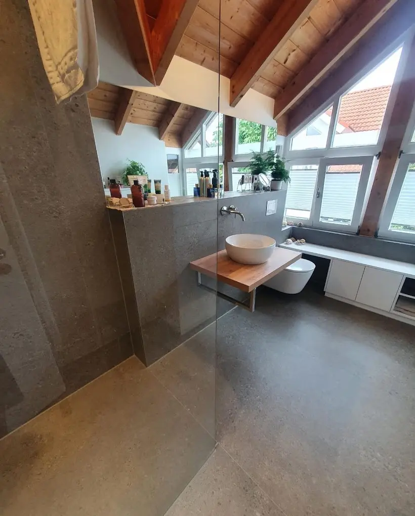 Refurbished loft bathroom with a level-access shower