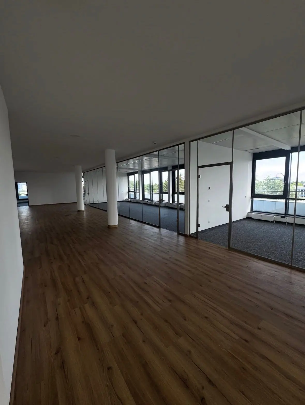 Refurbished office floor with glazed partitions and new vinyl flooring
