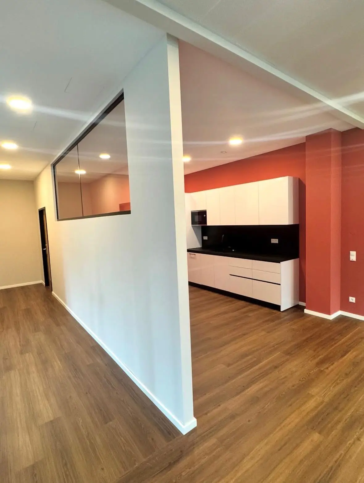 New office kitchenette with a black worktop