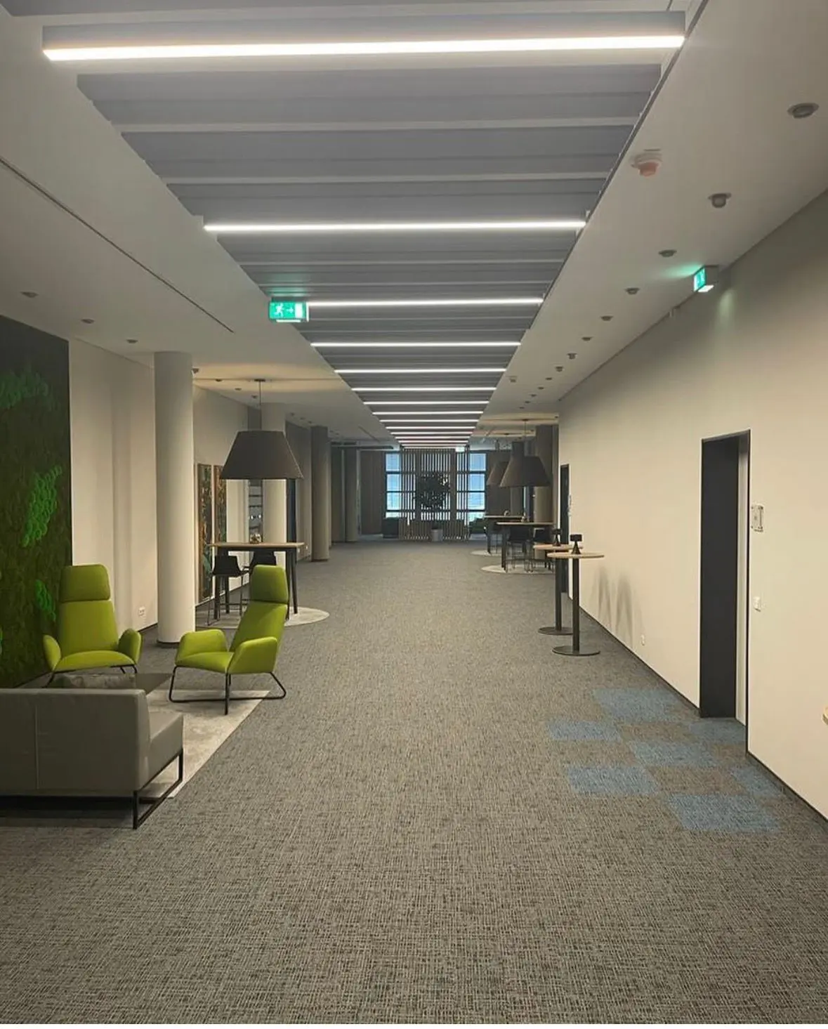 Lounge area with a moss wall and carpet tiles