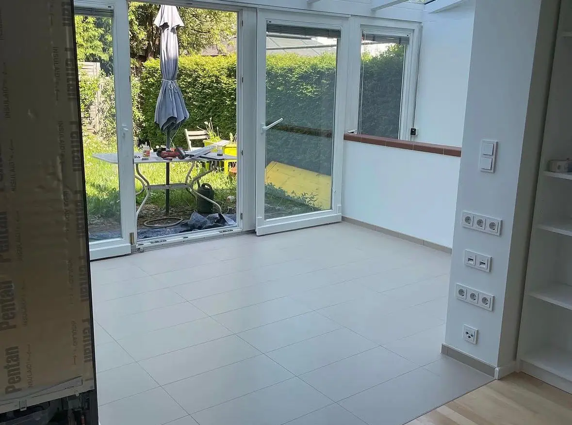 Conservatory with newly laid floor tiles
