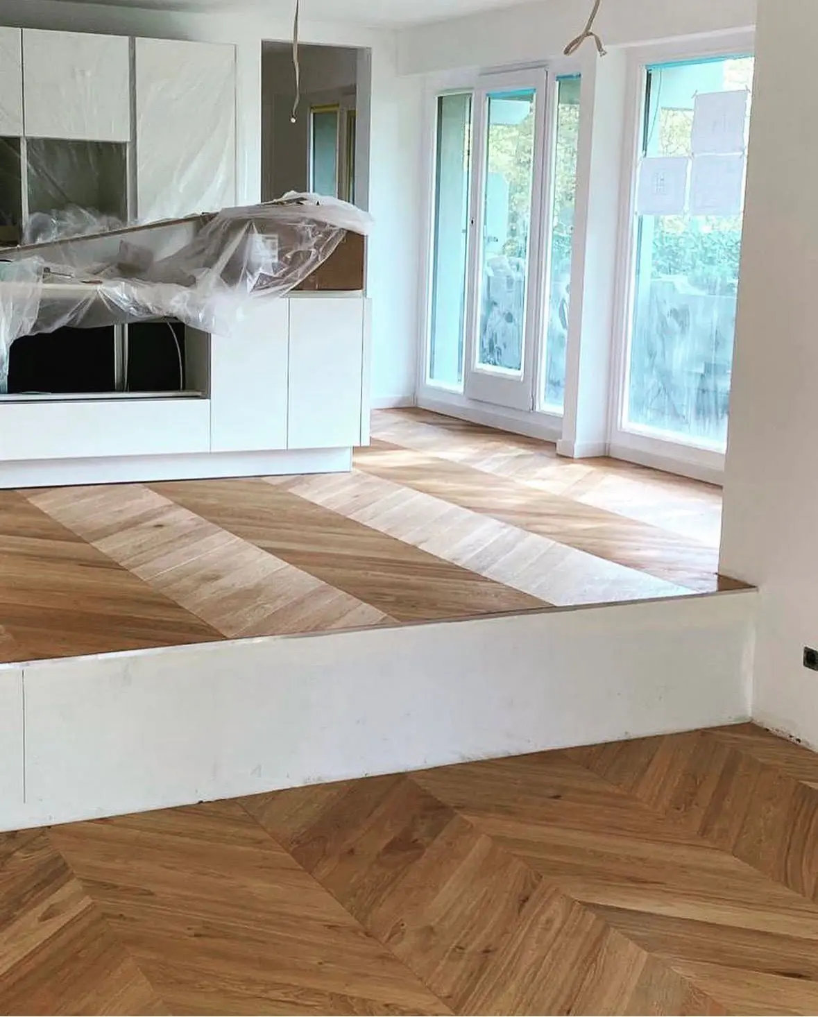 Newly laid chevron parquet during fit-out